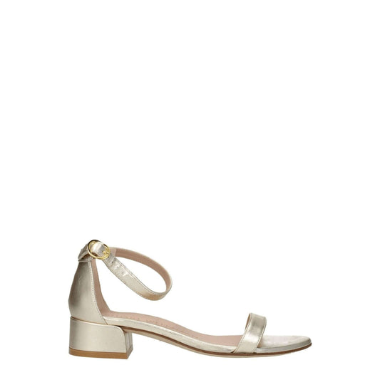Alt Tag: Stuart Weitzman Gold Leather Sandals with mid heel and buckle closure, featuring an open toe design and metallic platinum accents.