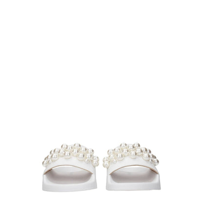 Stuart Weitzman White Leather Slippers with pearl front detail, open toe design and low flat heel, perfect for street style fashion.