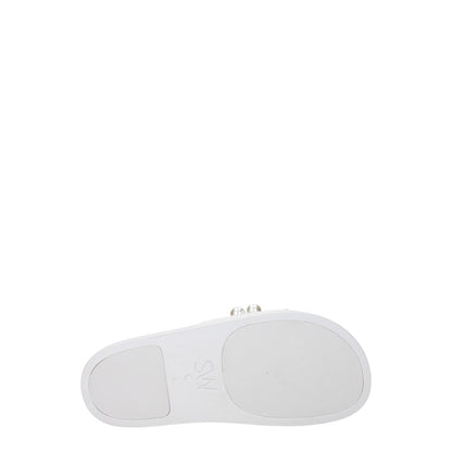 Sole view of Stuart Weitzman White Leather Slippers with rubber shoe sole and flat heel.