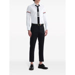 Model wearing Thom Browne Shirts White with RWB stripe, grosgrain loop, logo patch, and classic collar. Elegant style for any occasion.