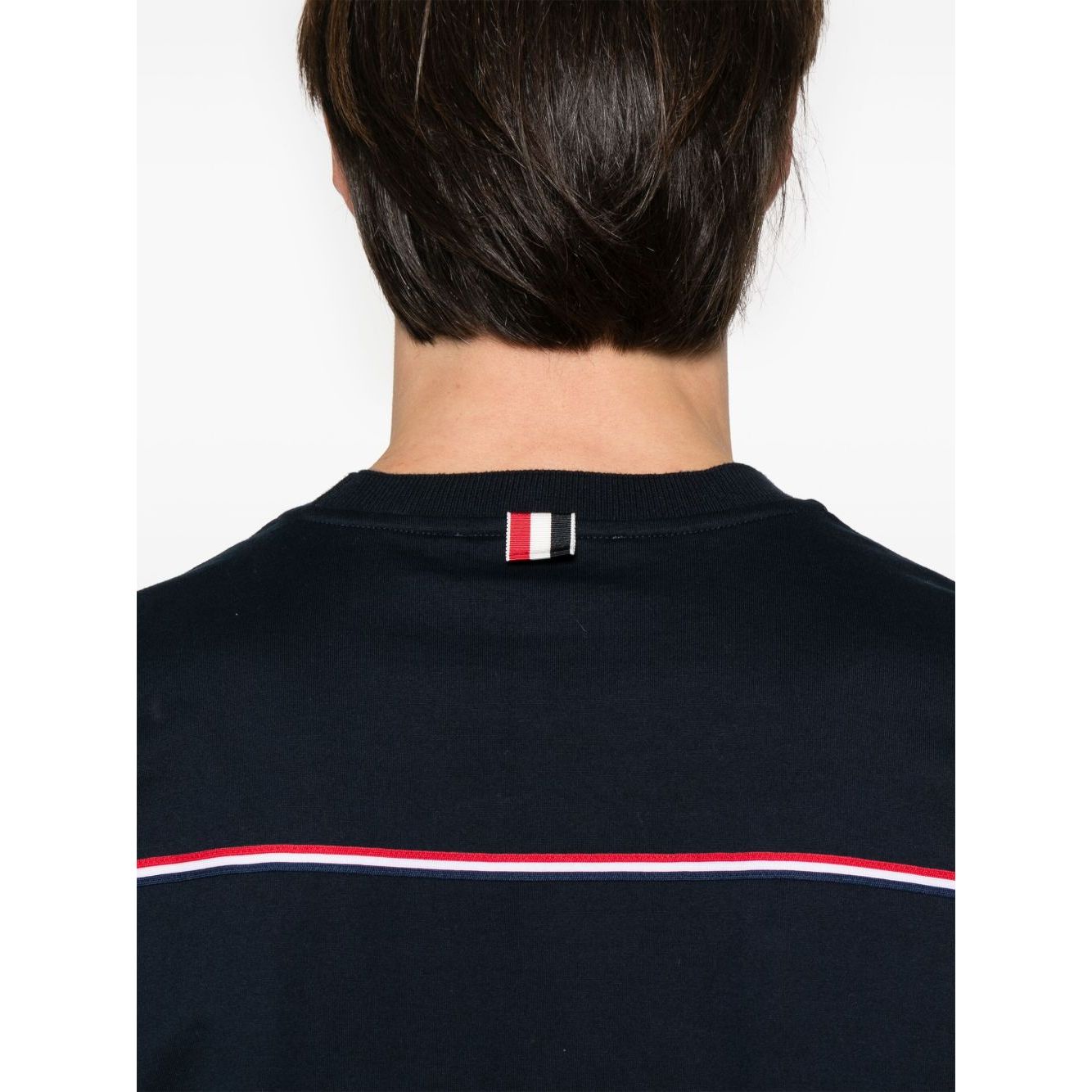 Thom Browne T-shirts and Polos Blue featuring midnight blue with signature grosgrain side tabs and RWB stripe detailing, back view.