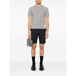Thom Browne T-shirts and Polos Light Grey with side button fastening, logo patch, and signature grosgrain side tabs, model wearing outfit.