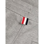 Close-up of Thom Browne Trousers Grey showing 4-Bar stripe and grosgrain loop tab detail.