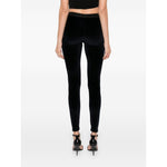 Rear view of model wearing Tom Ford Trousers Blue, high waist velvet leggings with elasticated logo waistband, skinny cut.