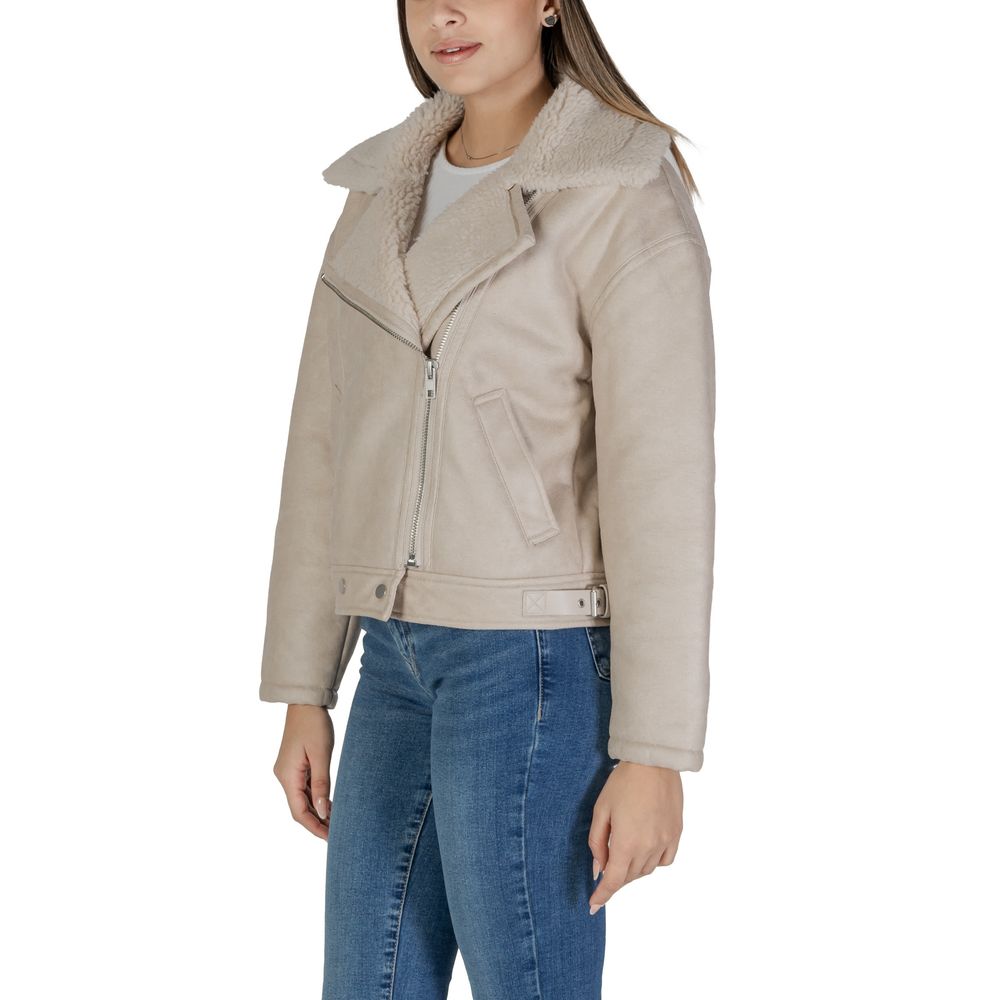 Vila Clothes Beige Artificial Leather Jackets & Coat with asymmetric zip and shearling collar, worn by a woman in jeans.