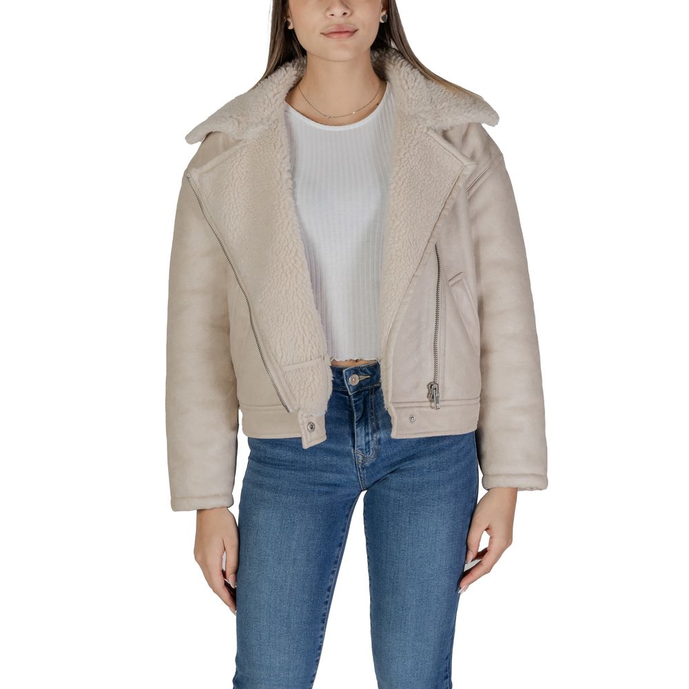 Woman wearing Vila Clothes Beige Artificial Leather Jackets & Coat with asymmetrical zip and shearling-effect collar.