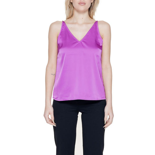 Woman wearing Vila Clothes Pink Polyester Top with V-neck and adjustable straps, showcasing a chic and modern style.